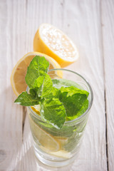 Soft drink with lemon, ice and mint