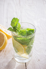 Soft drink with lemon, ice and mint