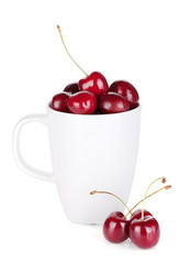 Ripe cherries in a cup