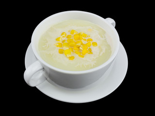 Corn cream soup isolated on the black background with clipping path