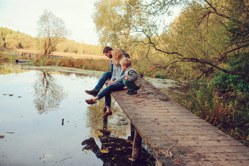 happy family spending time together outdoor. Lifestyle capture, rural cozy scene.