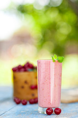 Smoothie with cherry and mint in a glass 