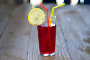 Cherry lemonade in glasses on a wooden table