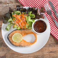 Grilled Salmon with barbeque sauce and fresh salad.