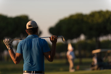 golfer from back at course looking to hole in distance