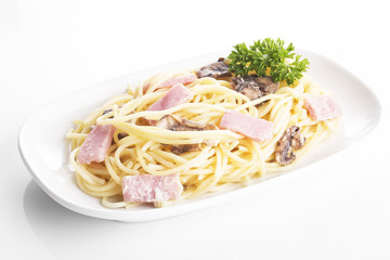 Carbonara spaghetti in plate on background