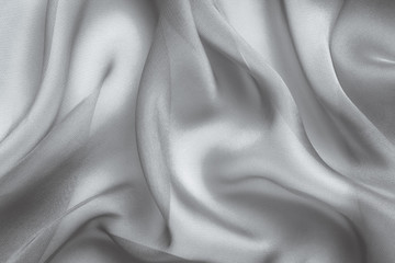 gray monochrome fabric with large folds abstract  background