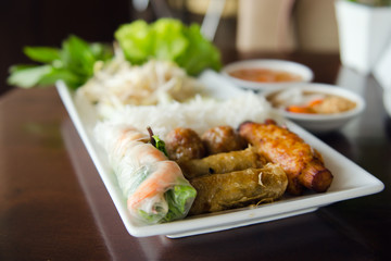 Spring roll with pork, fried shrimp with sugar cane and vegetabl