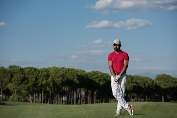 handsome middle eastern golf player portrait at course