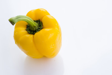 Ripe yellow bell peppers. Isolated on white background