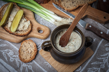 A slice of country bread with homemade lard and cucumber.