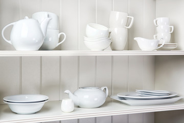 Dishes in cupboard in the kitchen