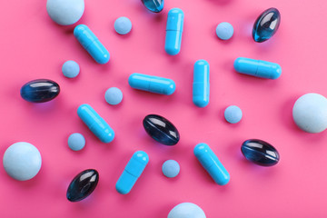 Color pills on pink background