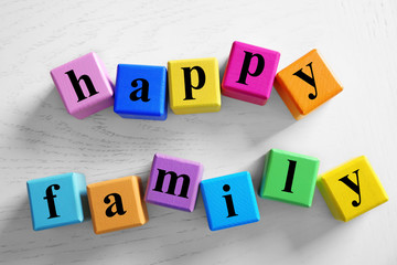 Color words HAPPY FAMILY on light background