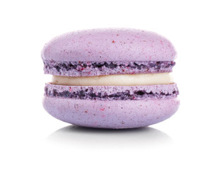 Purple tasty macaroon on white background