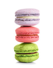 Tower of colorful tasty macaroons on white background
