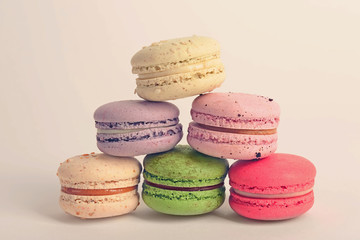 Tasty colorful macaroons on white background