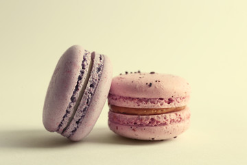 Tasty macaroons on white background