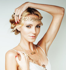 young blond woman dressed like ancient greek godess, gold jewelry close up isolated