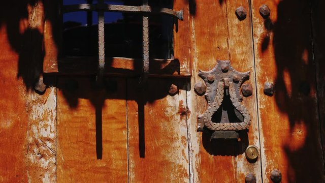 Door handle on an ancient door. In the town of Rupit, Spain