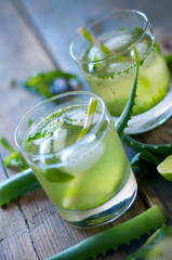 Aloe vera and lime cocktail with mint and ice cubes