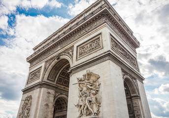Fototapeta na wymiar Arc de Triomphe with a dynamic blue sky
