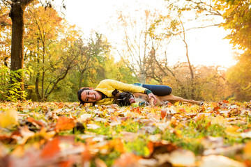 Young woman hugging her Dog in the Park
