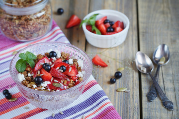 Dessert with fresh berries, cottage  cheese, granola and berries