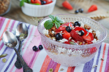 Dessert with fresh berries, cottage  cheese, granola and berries