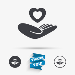 Life insurance sign. Hand holds heart.