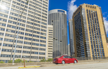 Fototapeta premium Passing car on motorway with skyscrapers of Sydney, Australia