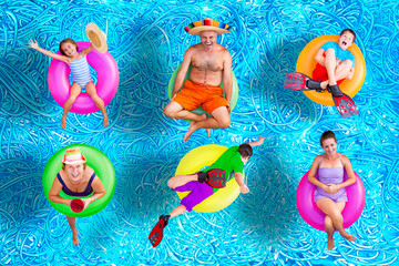 Family fun in the swimming pool in summer - obrazy, fototapety, plakaty