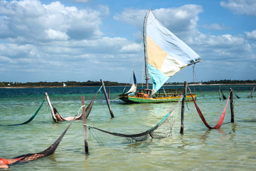 Sail boat and hammocks at the Paradise Lake, Jericoacoara, Brazil