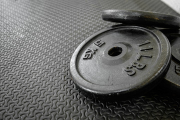 Obraz premium exercise weights - iron dumbbell with extra plates