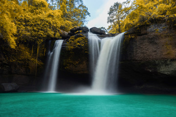 Fototapeta na wymiar Amazing beautiful waterfalls in autumn forest at Haew Suwat Waterfall in Khao Yai National Park, Thailand