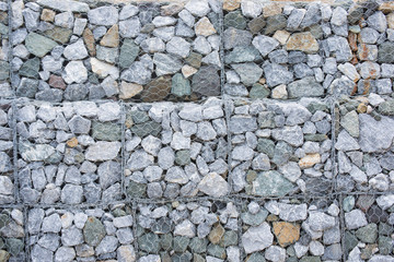 Stone walls in net prevent landslides