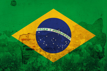 Flag of Brazil painted on Old grunge brick wall, background text