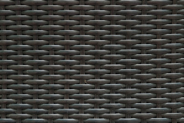 Closeup surface wood pattern at black painted wood weave chair texture background