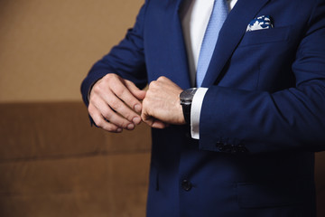 Obraz premium Businessman hands with cufflinks. Elegant gentleman clother