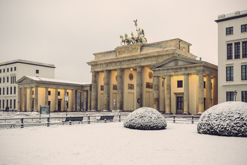 Brandenburg gate (Brandenburger Tor) in snow, Berlin, Germany, Europe, Vintage filtered style