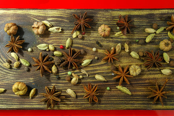 Colorful food background  -  spices on textured wood