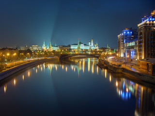 Fototapeta premium Moscow Kremlin at night, view from bridge across the river. Peaceful night scene: clear sky and city lights reflected in calm water. High dynamic range photo, combined from 6 different exposures.