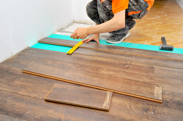 Carpenter doing laminate floor work