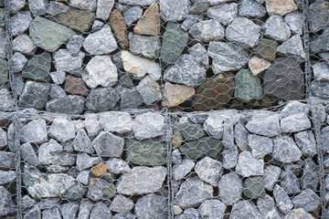 Stone walls in net prevent landslides