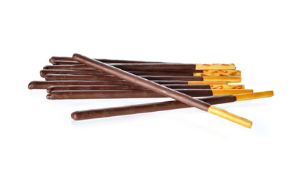 crackers stick and coated with black chocolate on white backgrou