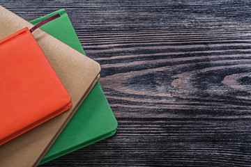 Note-books on vintage wooden board education concept