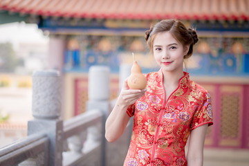 The Asian Chinese woman in Traditional Chinese hold calabash