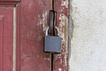 Old rusty padlock on old door