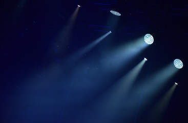 Fototapeta Blue stage lights, light show at concert obraz