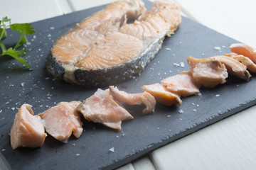 Salmon cooked in board